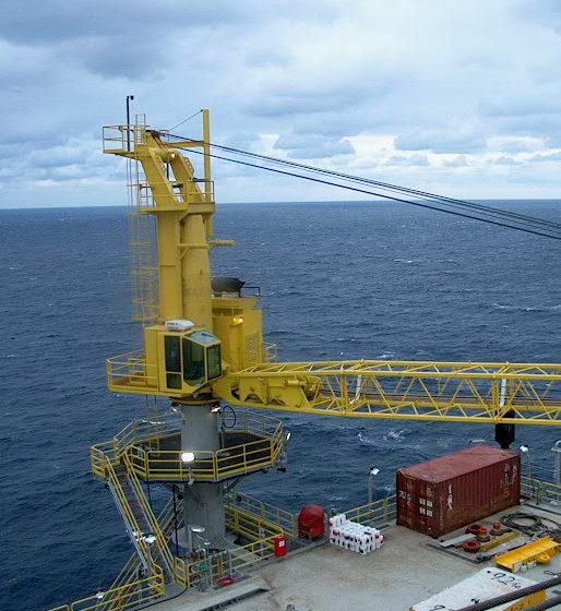 Yellow marine pedestal crane on a ship